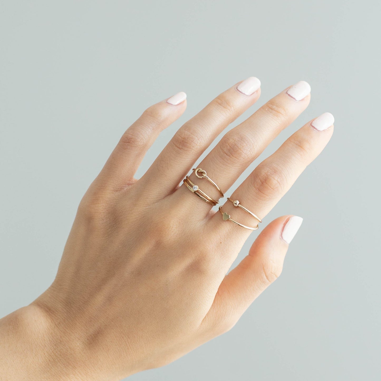 women wearing 14k gold filled stacking rings