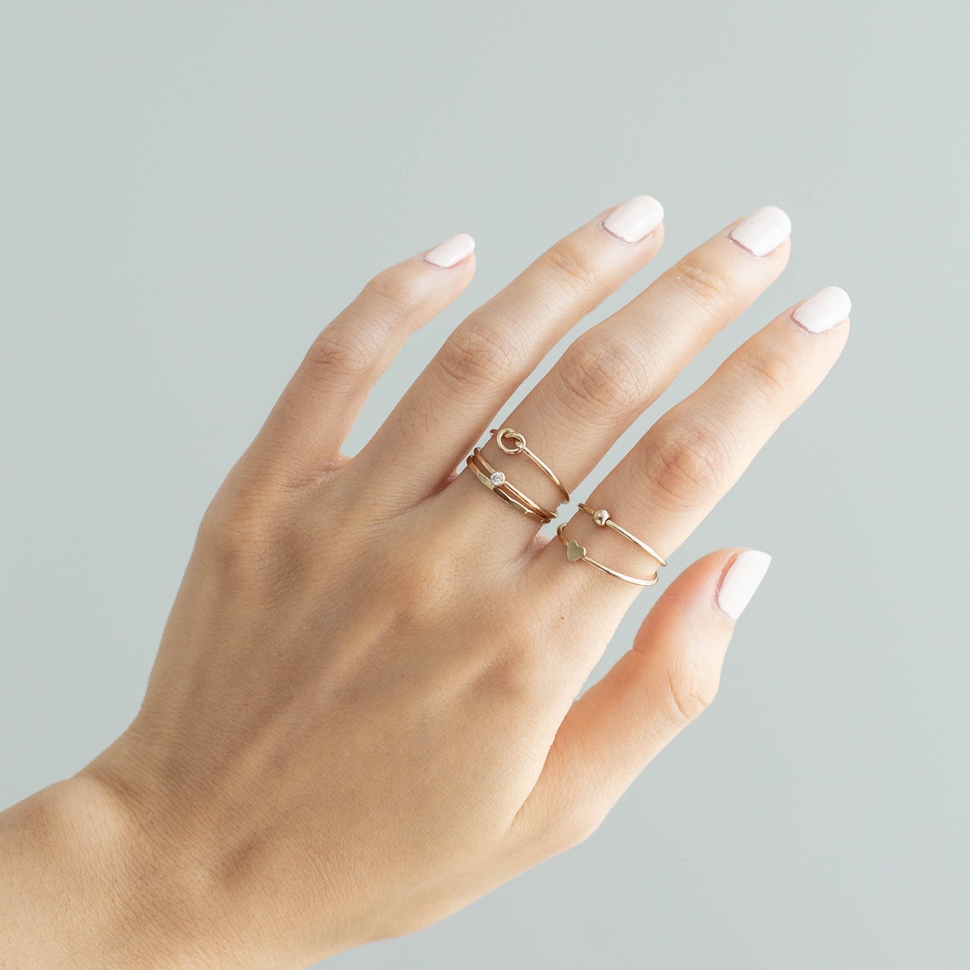 women wearing 14k gold filled stacking rings