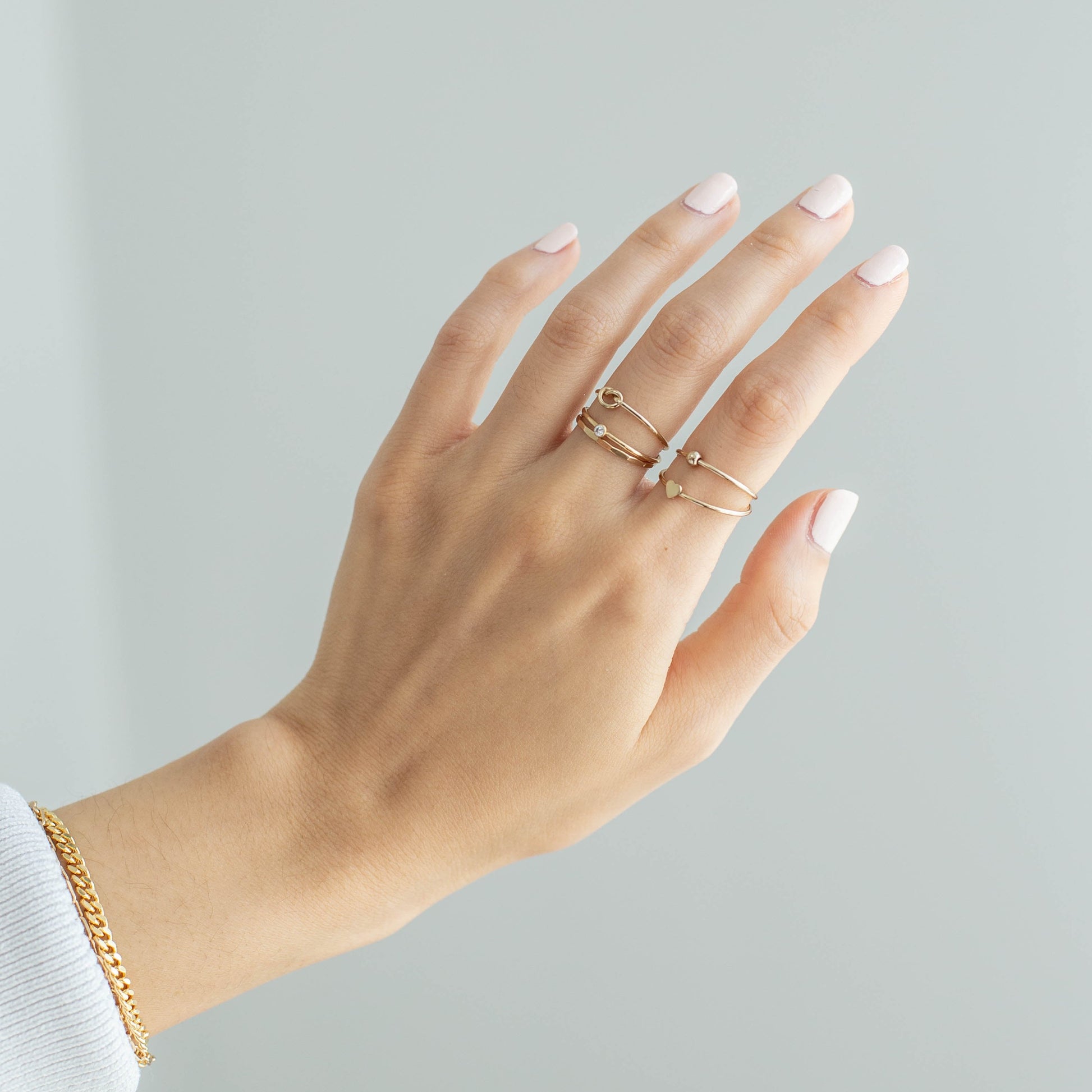 14k gold filled stacking rings on hand