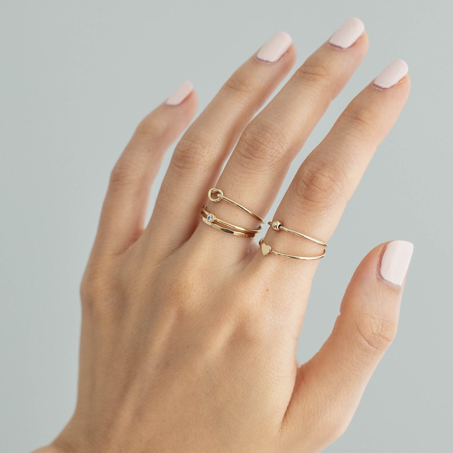 14k gold filled stacking rings on hand