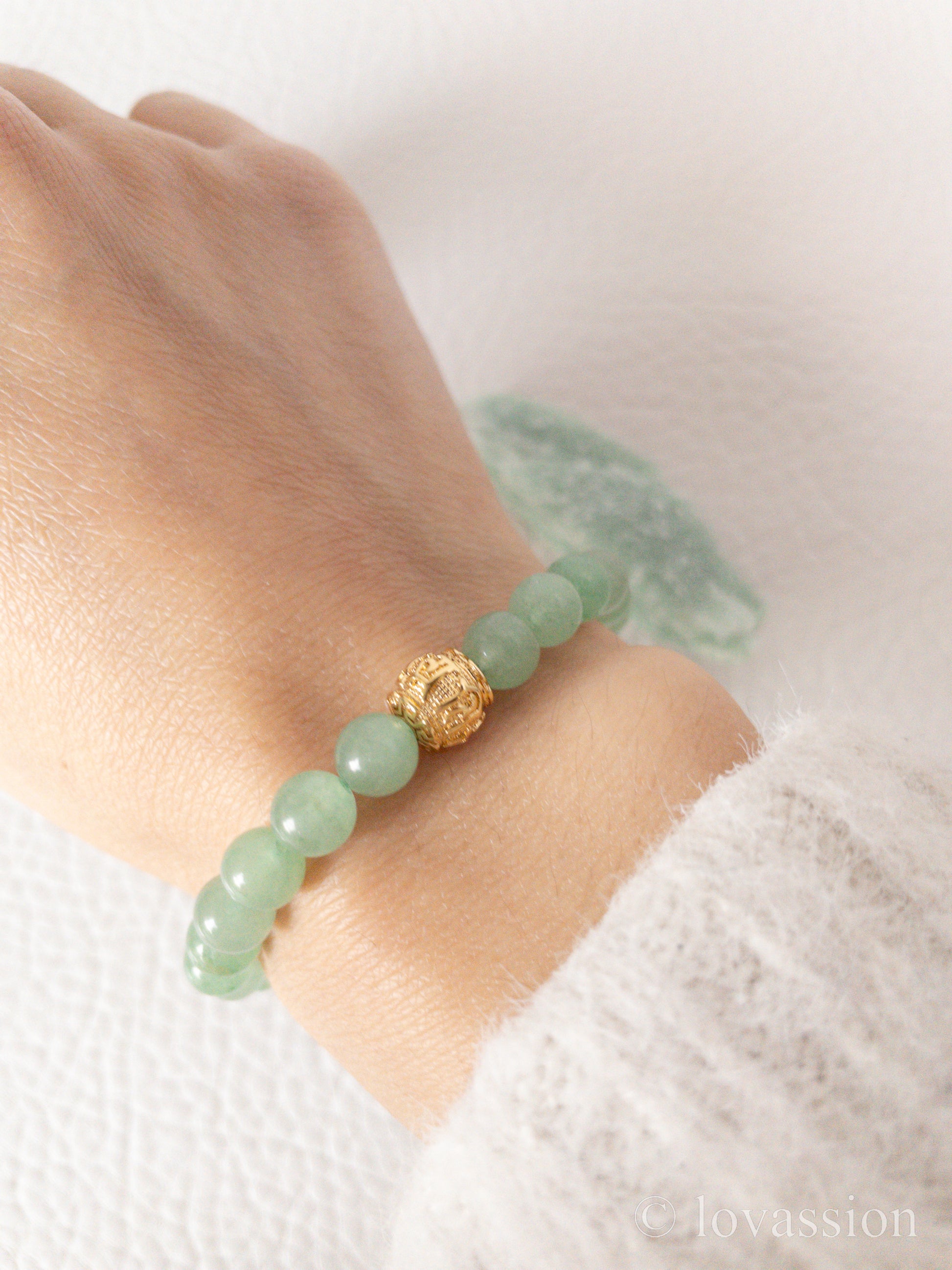 green aventurine bracelet on hand