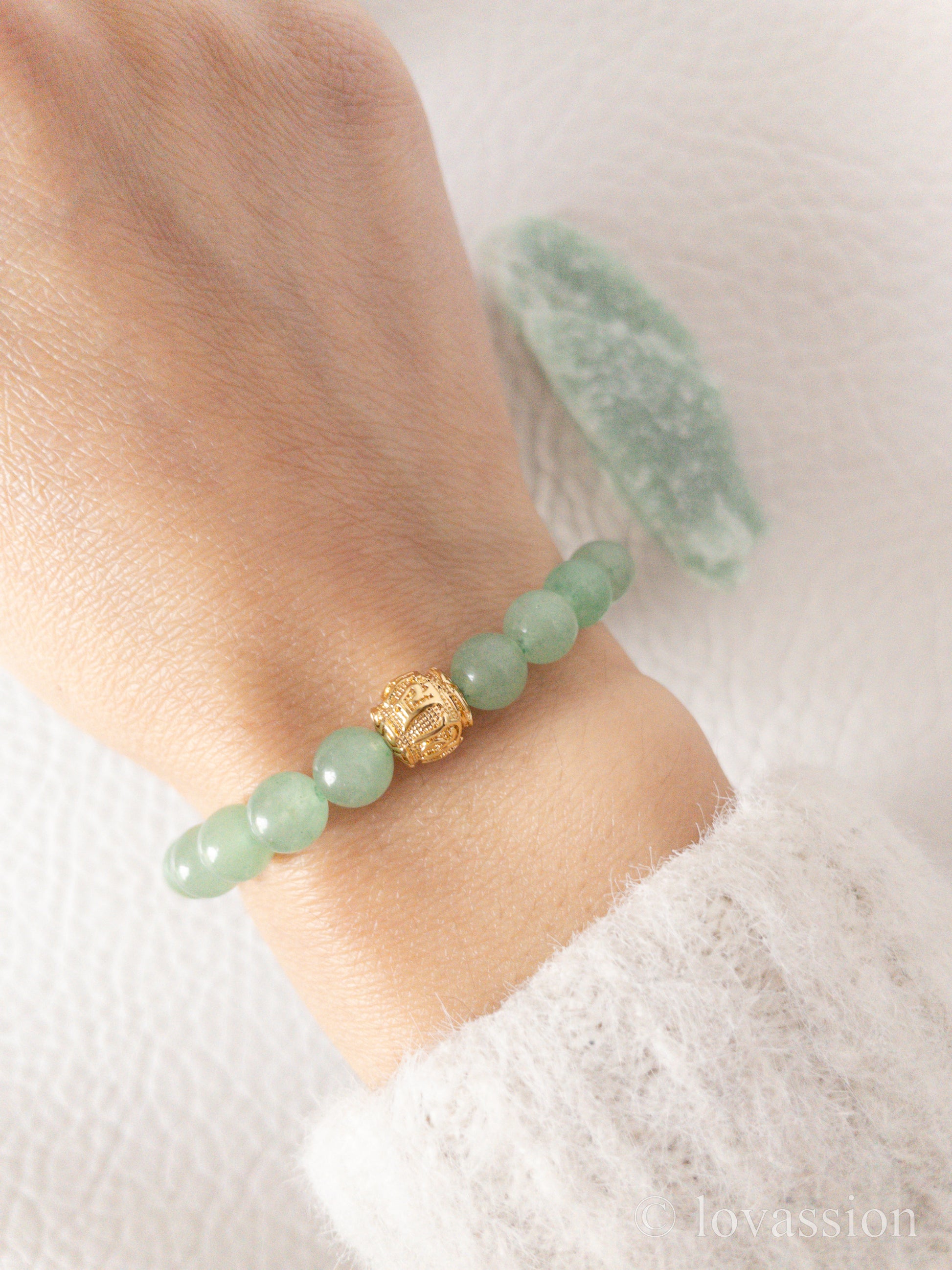 green aventurine bracelet on hand