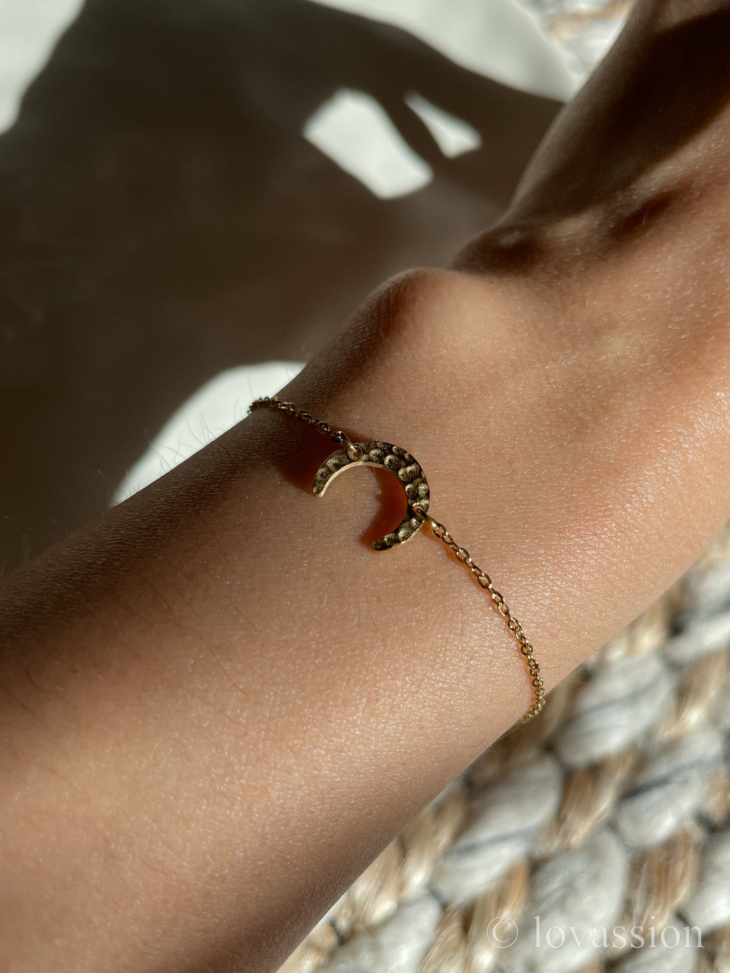 Crescent moon friendship bracelet on wrist