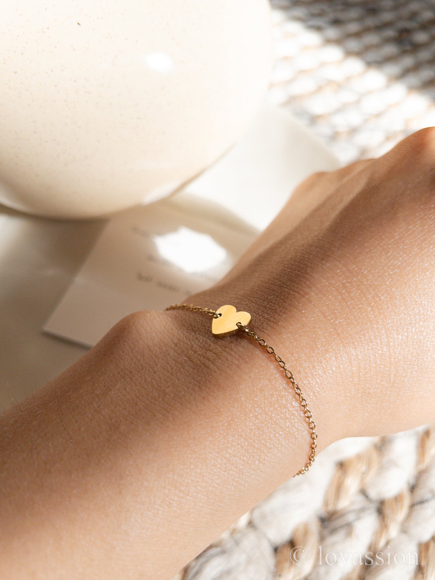 heart charm friendship bracelet on wrist