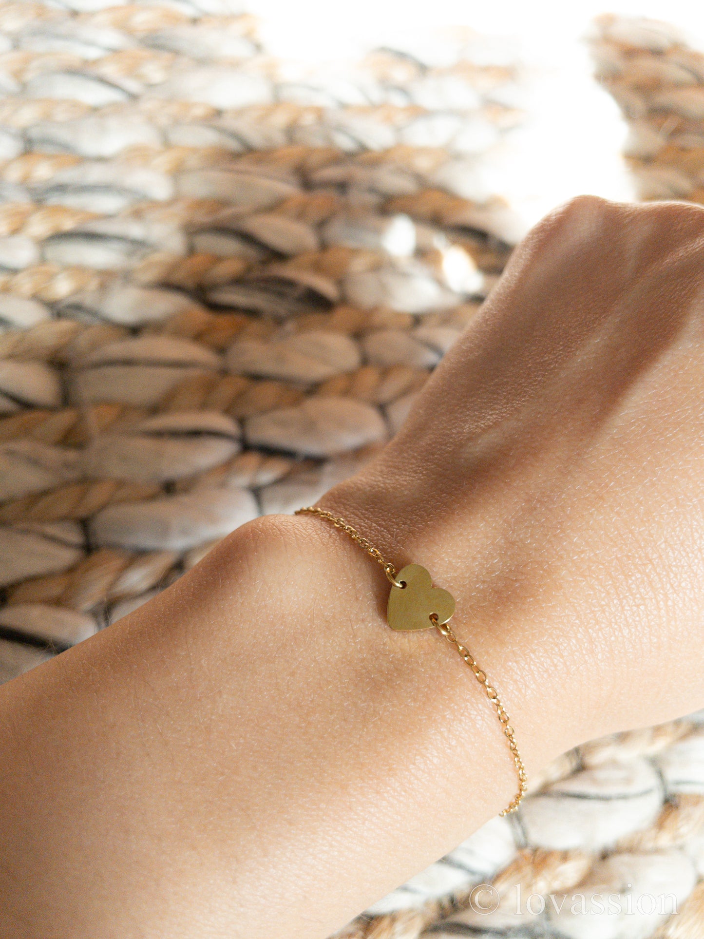 heart charm friendship bracelet on wrist