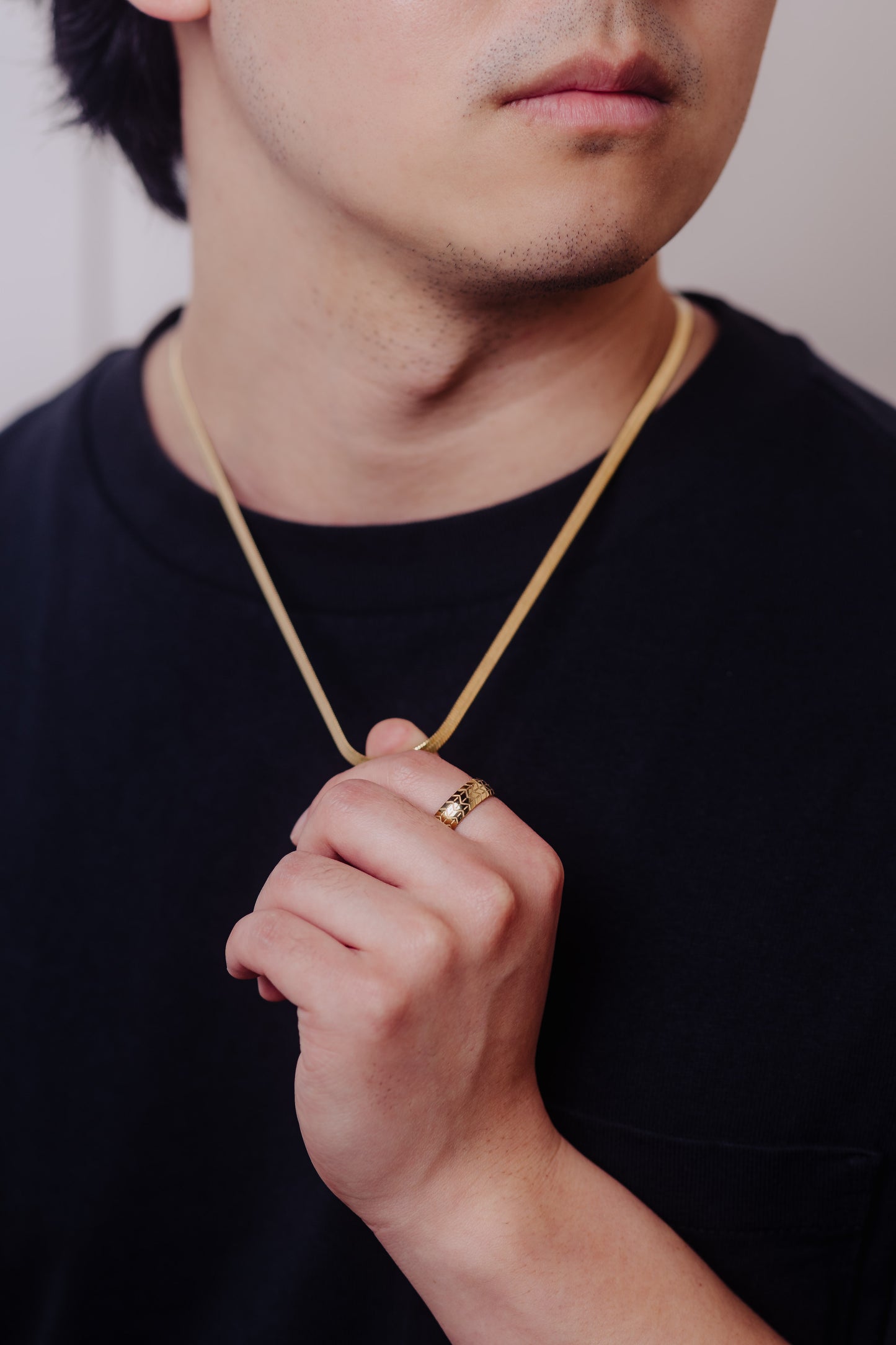men wearing herringbone necklace