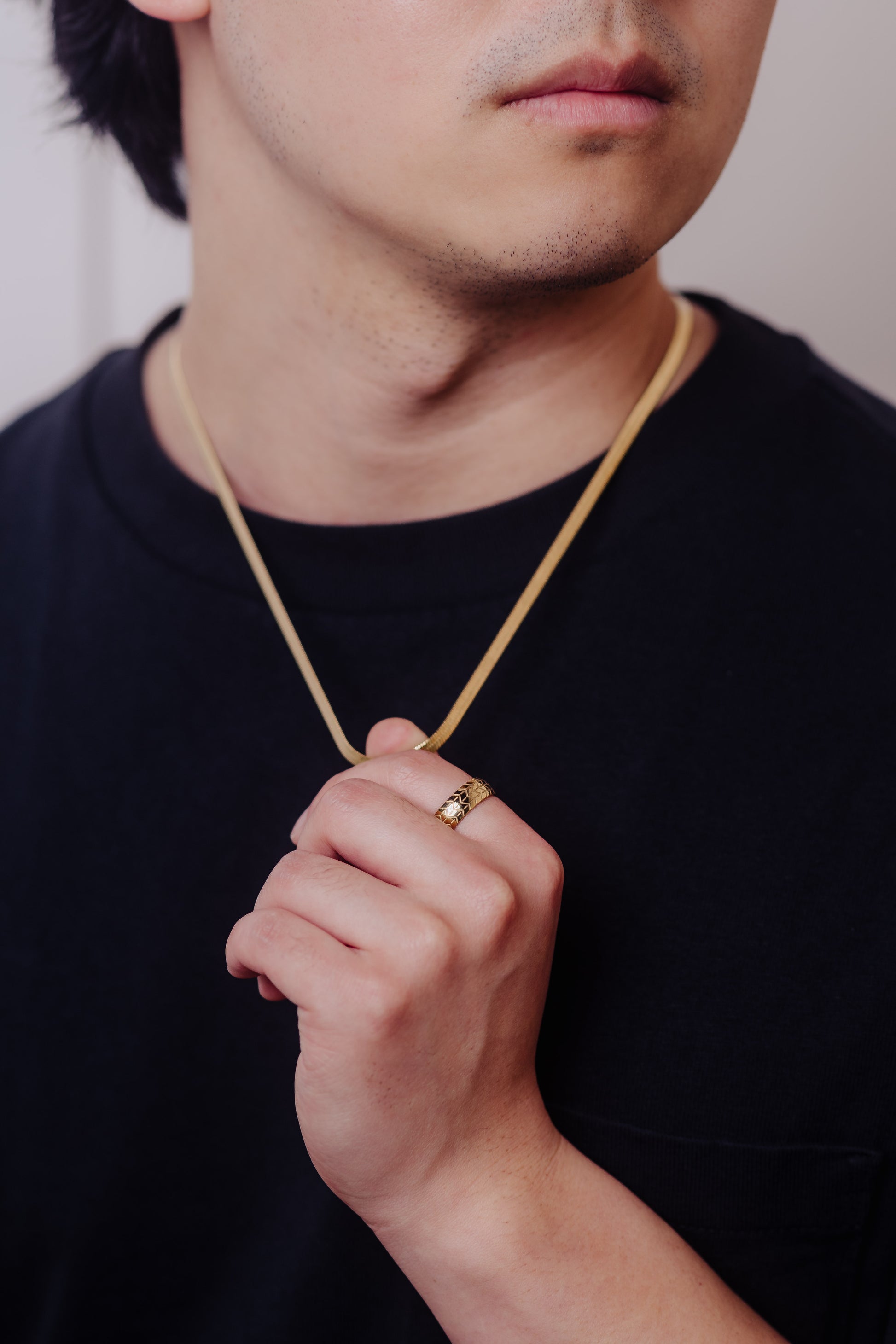 men wearing herringbone necklace