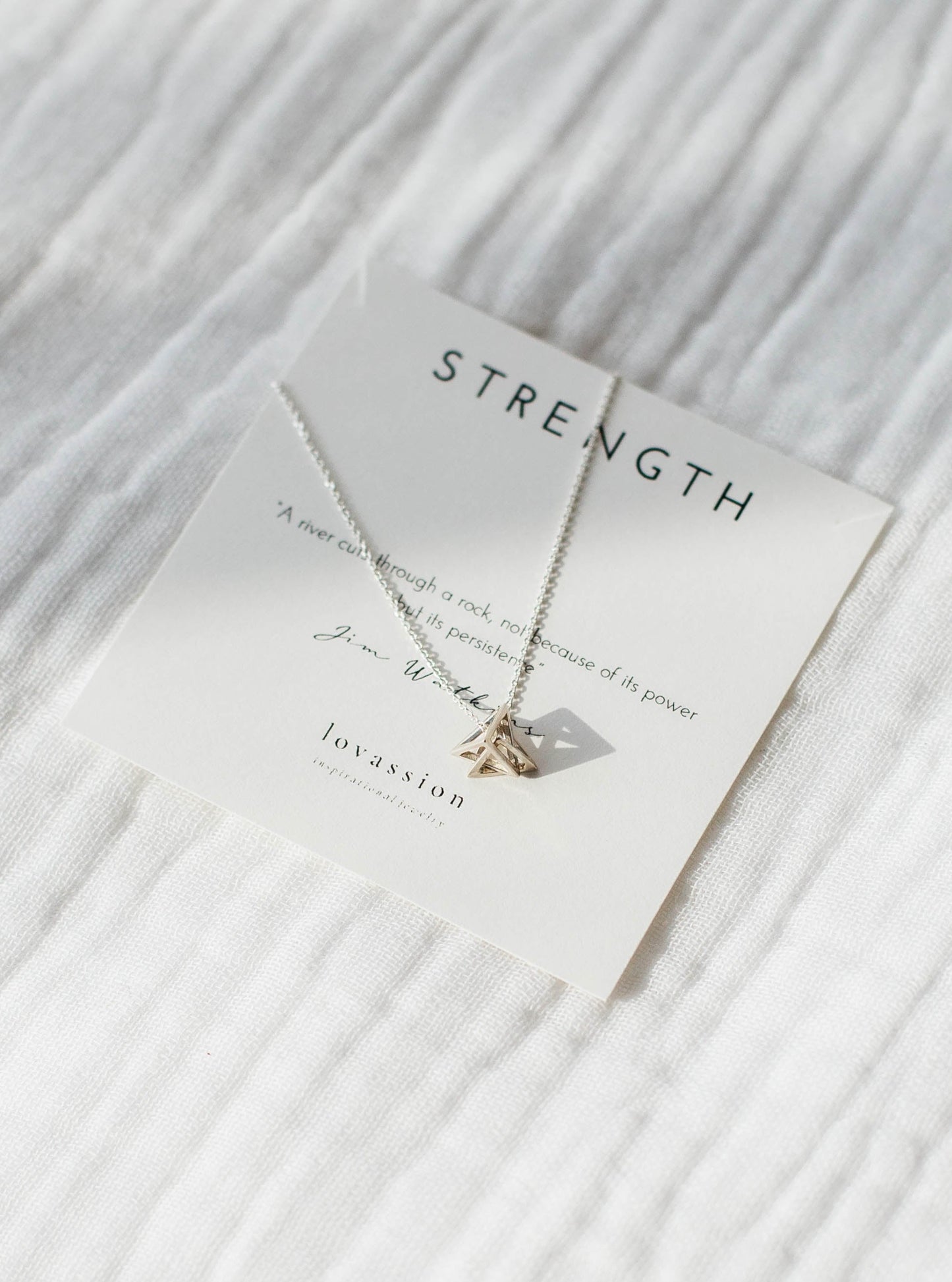 silver geometric triangle necklace with strength quote