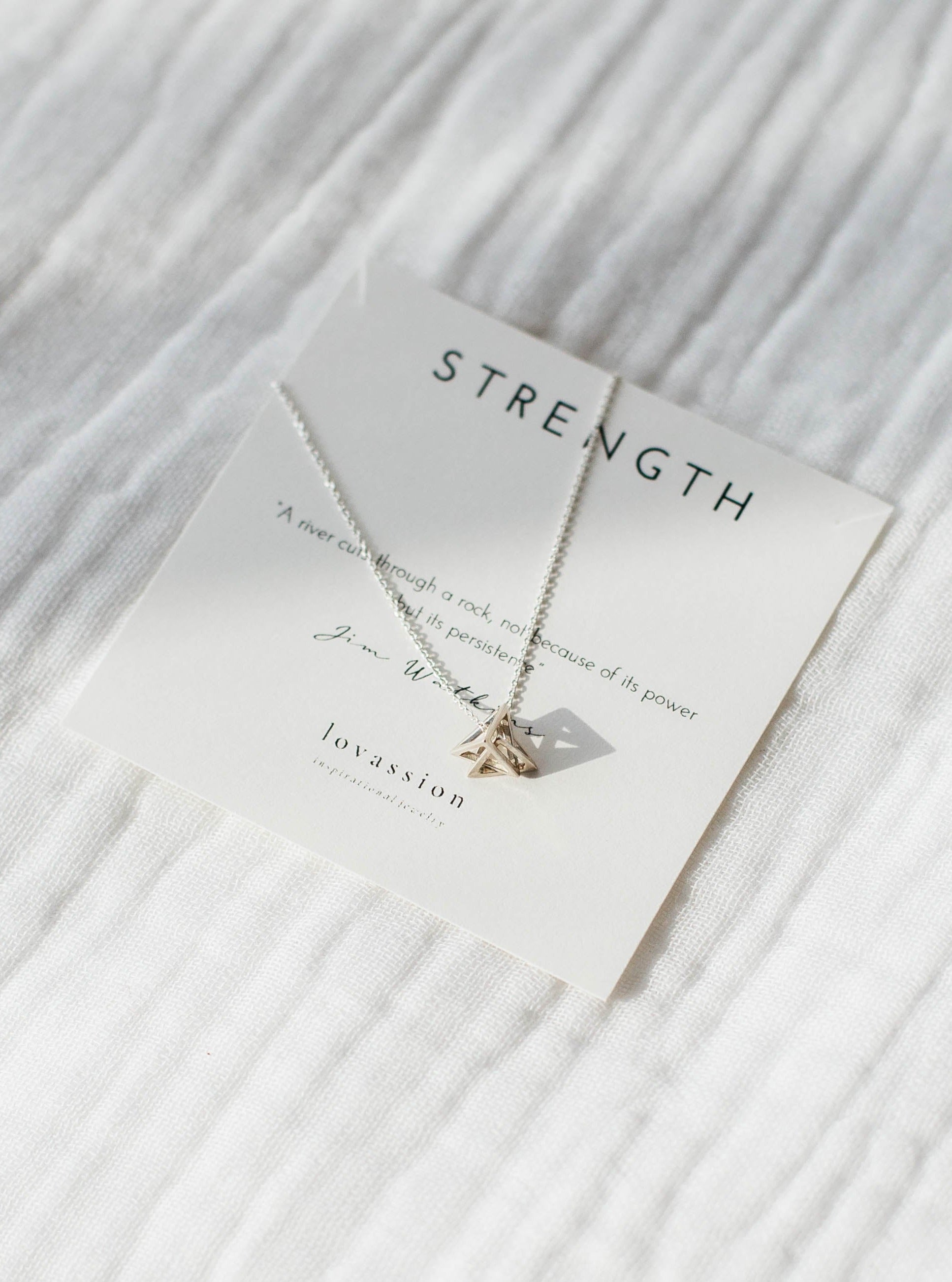 silver geometric triangle necklace with strength quote
