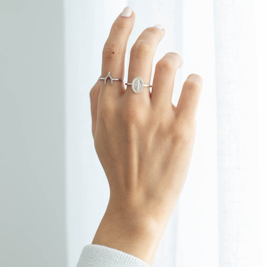 silver wishbone ring on hand