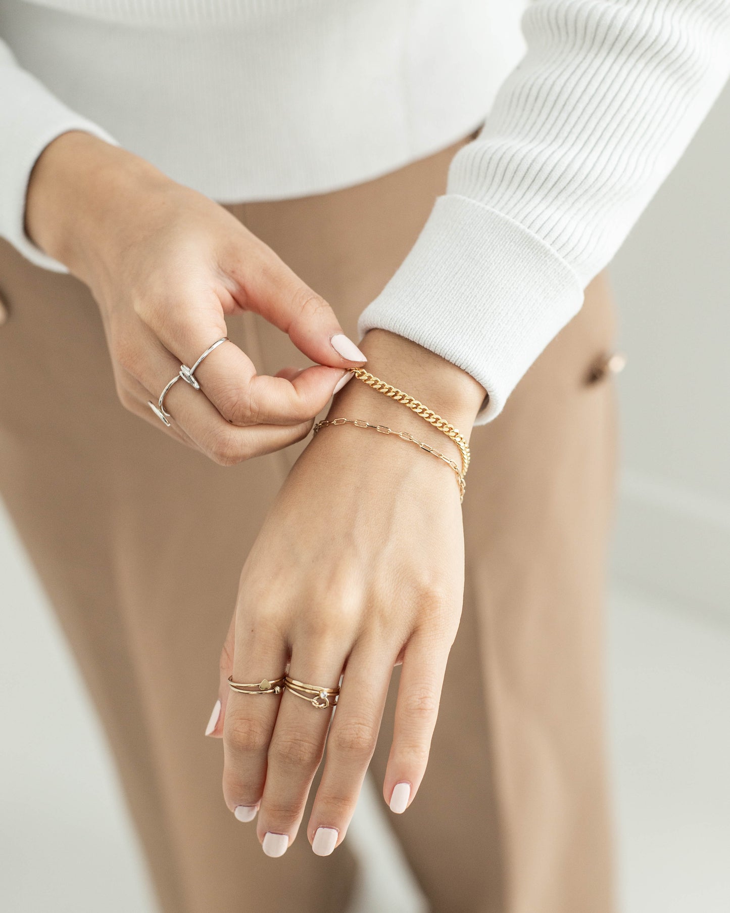 women wearing paperclip bracelet set