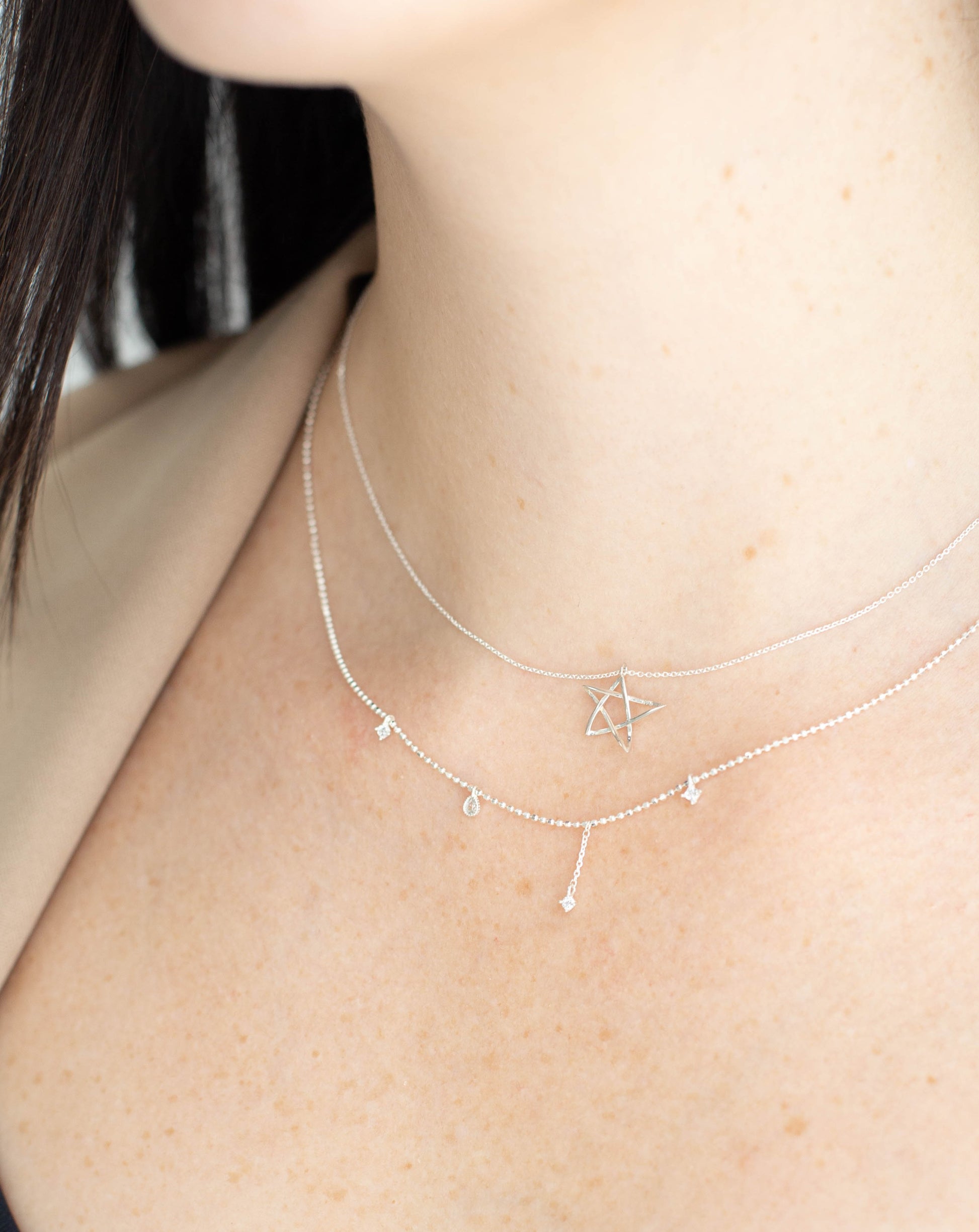 women wearing y2k dainty star necklace set