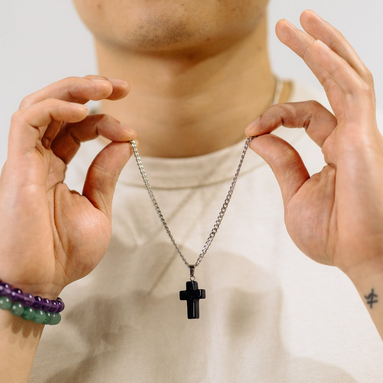 men wearing cross necklace, gemstone jewelry