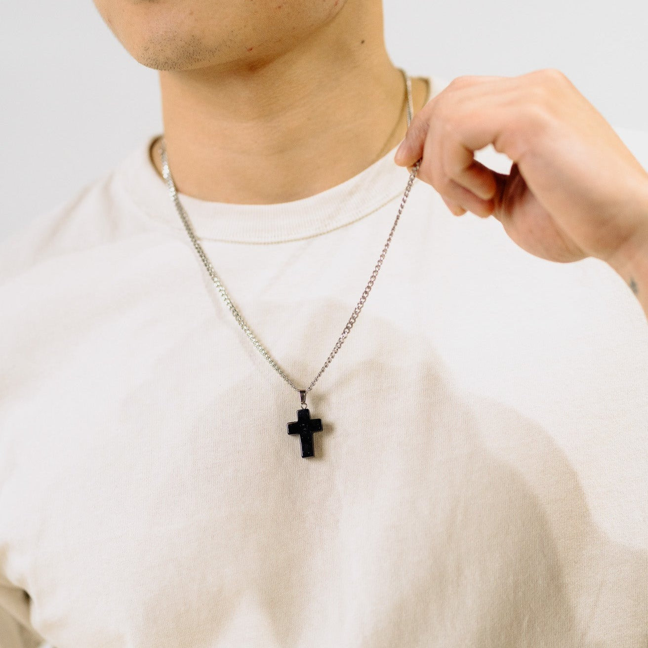 men wearing cross necklace, gemstone jewelry