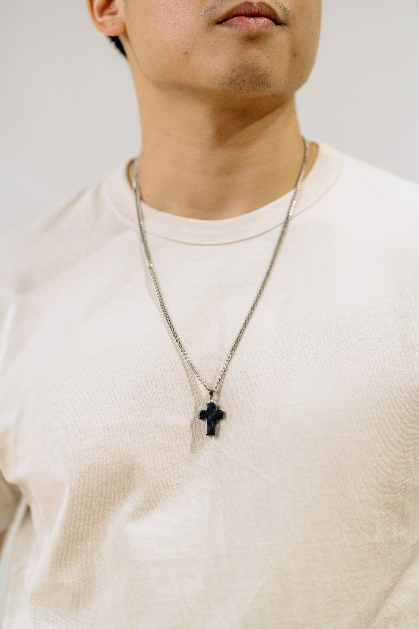 men wearing cross necklace, gemstone jewelry